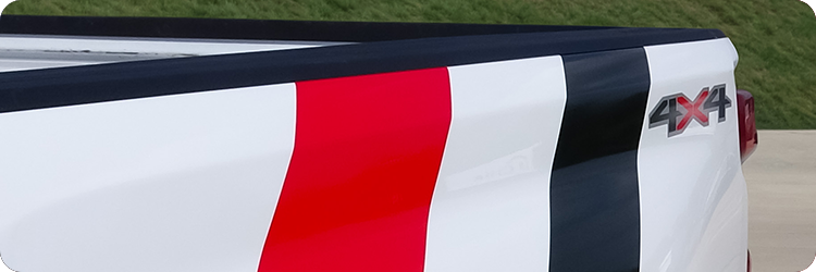 White truck bed wrapped with Crimson Crush and Gloss Black color change vinyl stripes using Briteline ColorCAST
