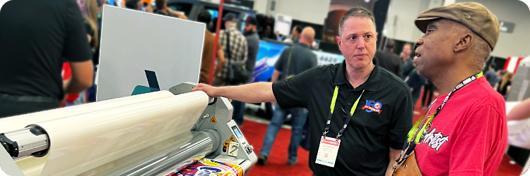 Photo of Matt Barclay talking with customer
